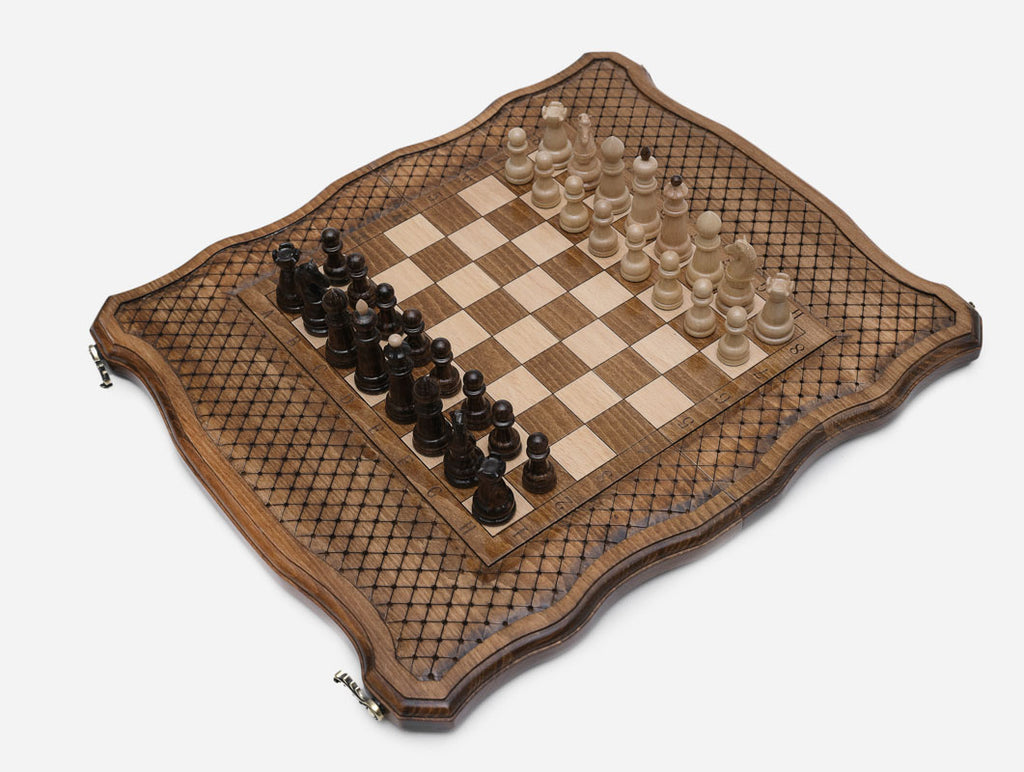Handle chess set open at an angle showing the full board and pieces in play position