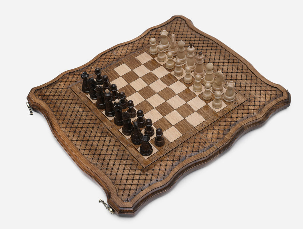 Handle chess set open at an angle showing the full board and pieces in play position