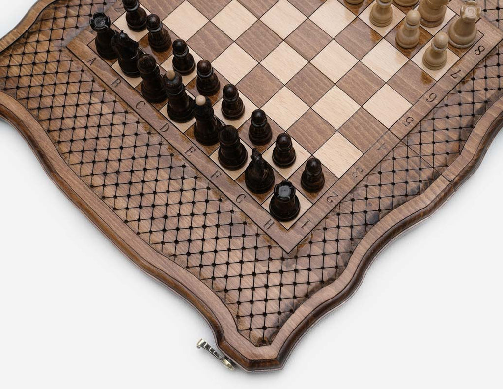 Close-up of the engraved board coordinates and dark walnut chess pieces