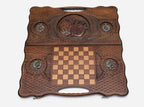The backgammon board opened to show the wooden playing surface