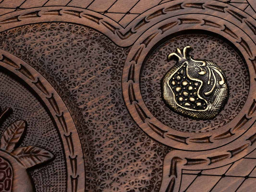 Detail of a bronze pomegranate side medallion