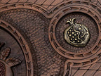 Detail of a bronze pomegranate side medallion