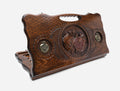 Carved beechwood backgammon board with a bronze pomegranate medallion and a carry handle, propped open