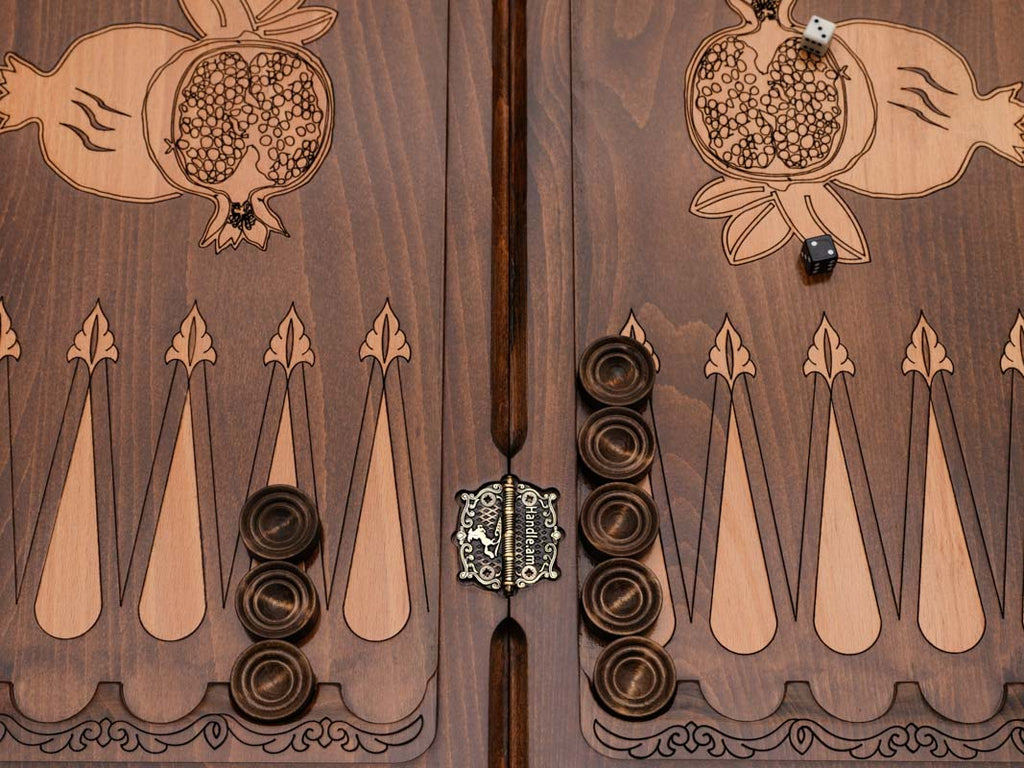 Close-up of the central bronze and wood pomegranate