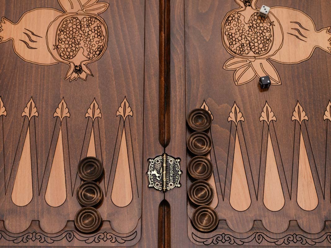 Close-up of the central bronze and wood pomegranate