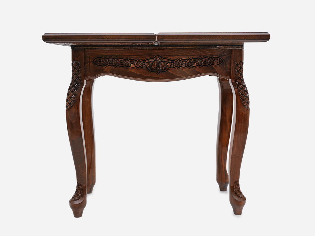 Close-up of the Handle Rosette Ornament table leg and apron carving