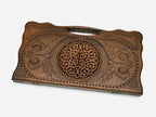 Angled view of the knotwork rosette carved backgammon board