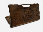Carved beechwood backgammon board with an interlaced knotwork rosette and a carry handle, propped open