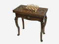 Handle Lion chess and backgammon table set up for chess, angled view showing the carved lion legs
