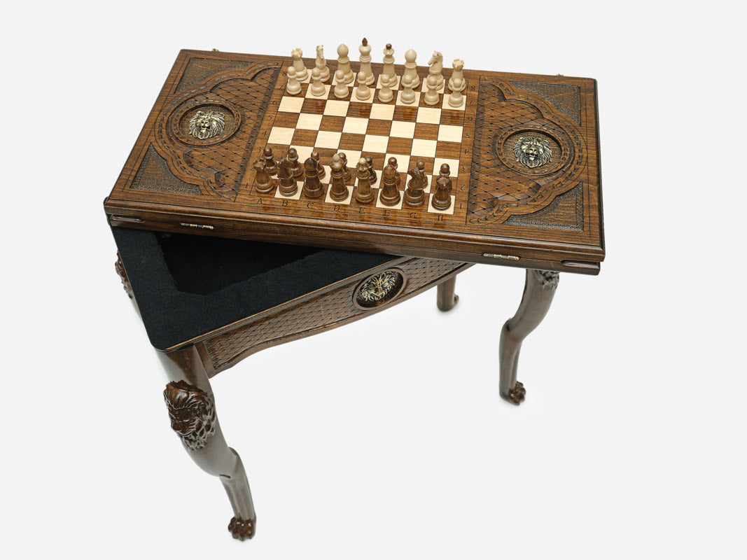 Handle Lion table opening to reveal the backgammon storage compartment