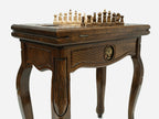 Close-up of the Handle Tree of Life table leg and drawer carving