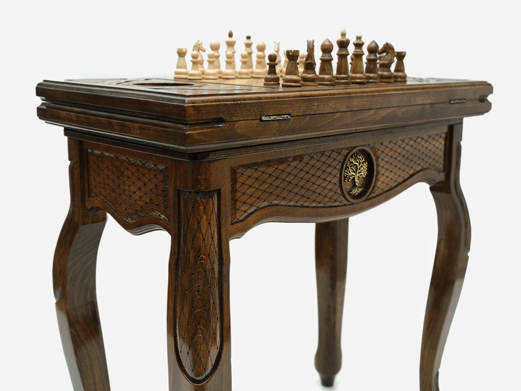 Close-up of the Handle Tree of Life table leg and drawer carving