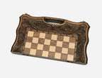 The folding chess board partly closed, showing its briefcase form and carved handle