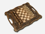 Top-down view of the fully opened board with acanthus-carved borders and side carry handles