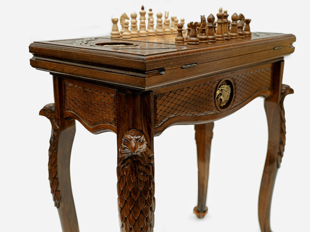 Close-up of the Handle Eagle table leg and drawer carving