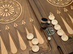 Close-up of the backgammon checkers, dice and cup on the Handle Eagle table