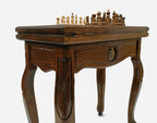 Close-up of the Handle Pomegranate table leg and drawer carving