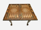 Handle Pomegranate table opened flat for backgammon with checkers set up, top-down view