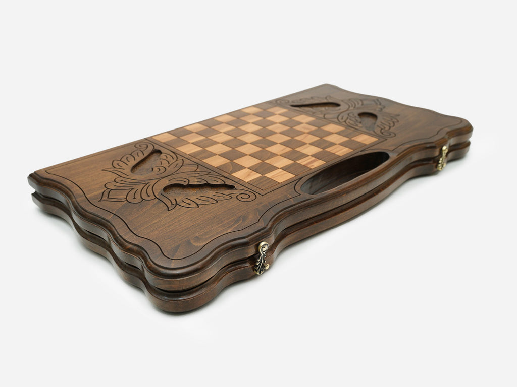 The backgammon board opened to show the wooden playing surface
