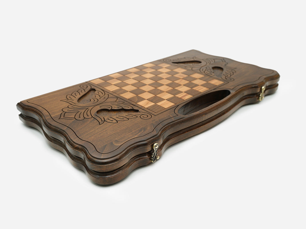 The backgammon board opened to show the wooden playing surface