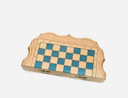 The compact blue epoxy chess set shown from an angle