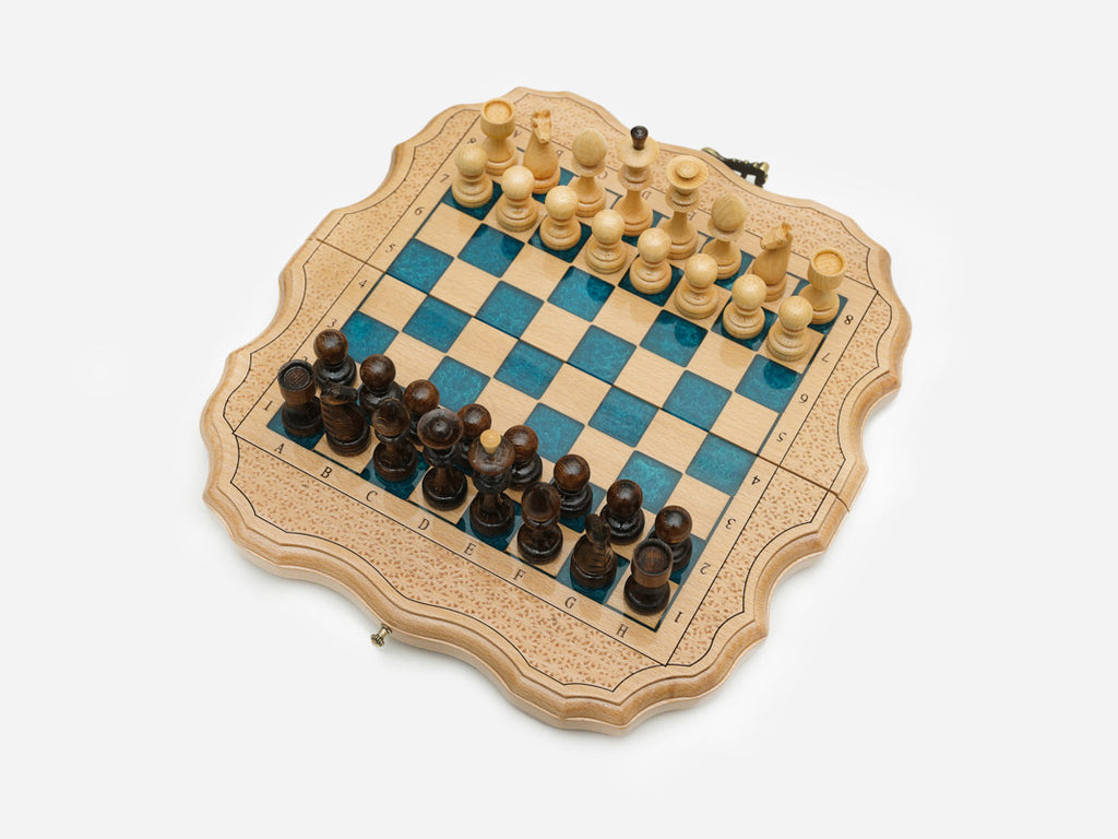 Angled view of the compact blue epoxy chess set
