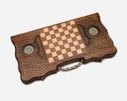 The backgammon board opened to show the wooden playing surface