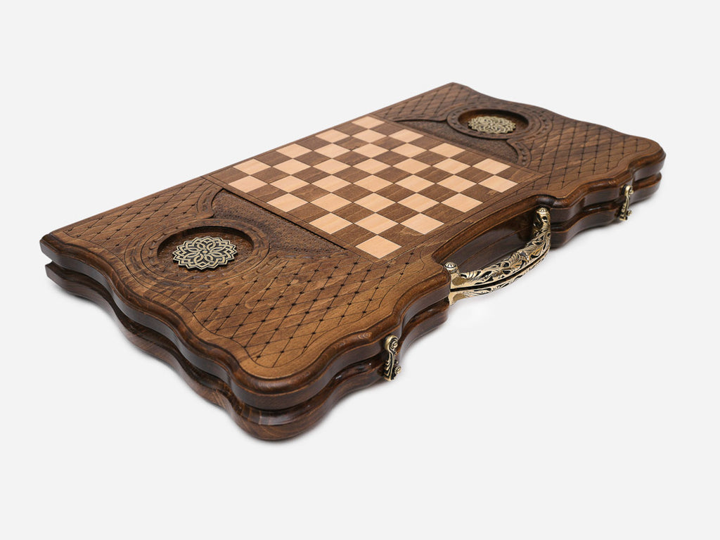 The ornate bronze carry handle