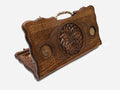 Carved beechwood backgammon board with a floral rosette, bronze medallions and an ornate bronze handle, propped open