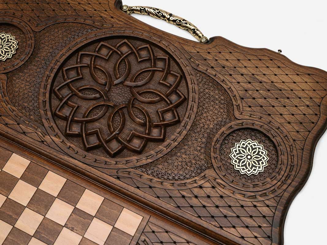 Angled view of the bronze ornament carved backgammon board