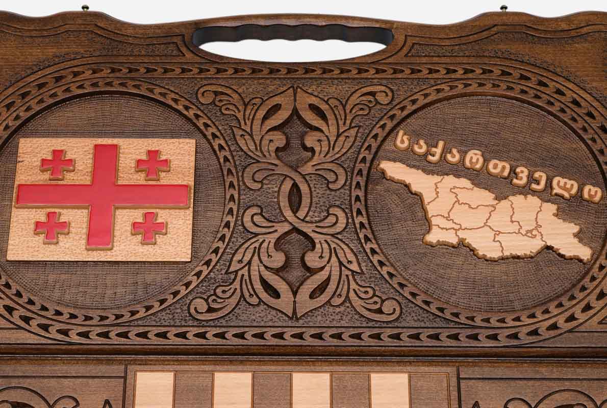 Angled view of the Georgia flag and map carved backgammon board