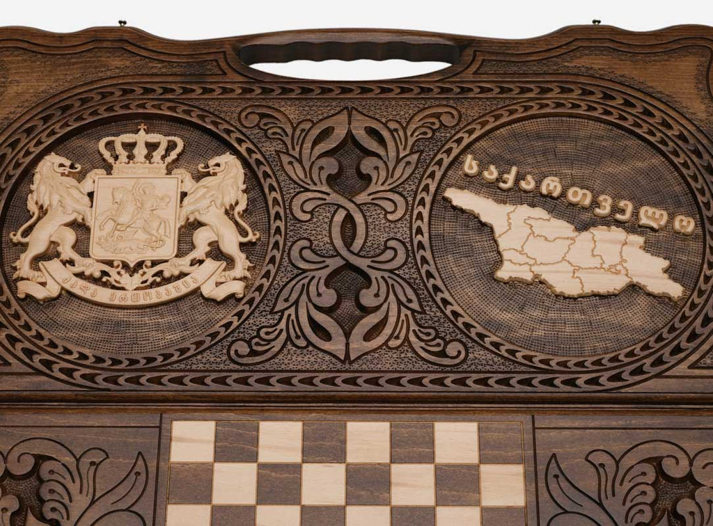 Angled view of the Georgia coat of arms and map carved backgammon board