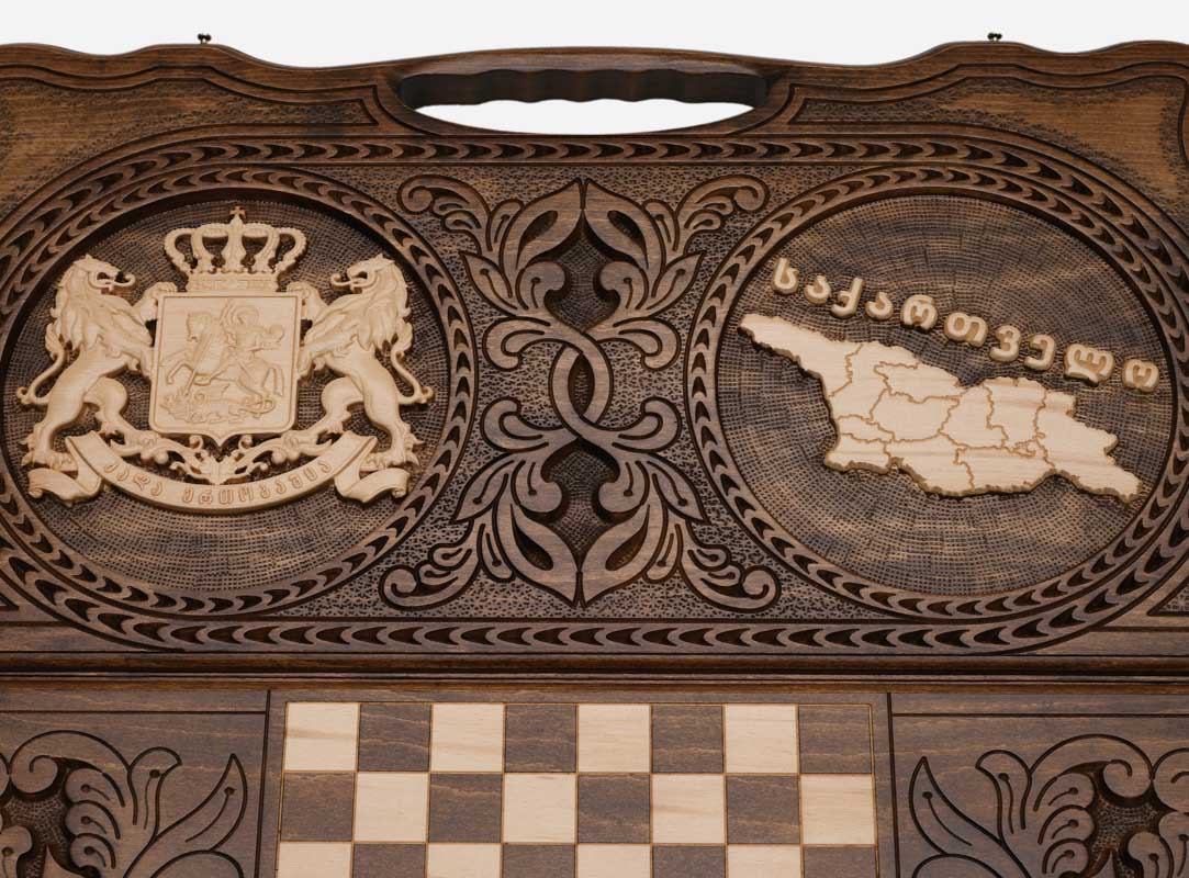 Angled view of the Georgia coat of arms and map carved backgammon board