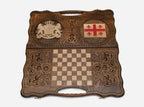 Angled view of the Georgia coat of arms and flag carved backgammon board
