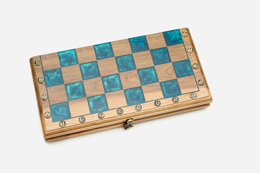 Top-down view of the glossy turquoise epoxy squares and walnut light squares
