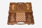 The backgammon board opened to show the wooden playing surface