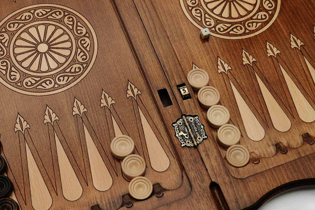 Angled view of the ornate rosette carved backgammon board