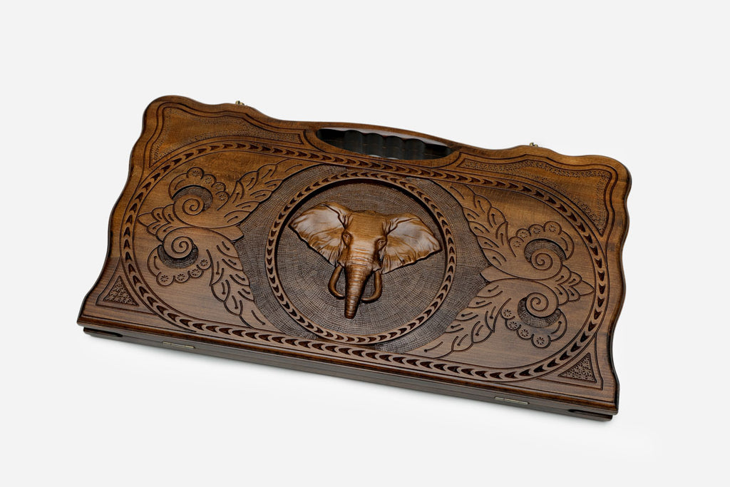 Angled view of the elephant carved backgammon board