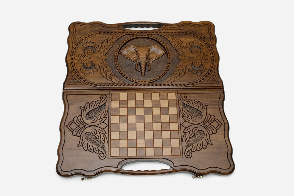 The backgammon board opened to show the wooden playing surface