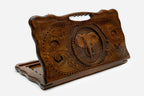 Carved beechwood backgammon board with an elephant medallion and a carry handle, propped open