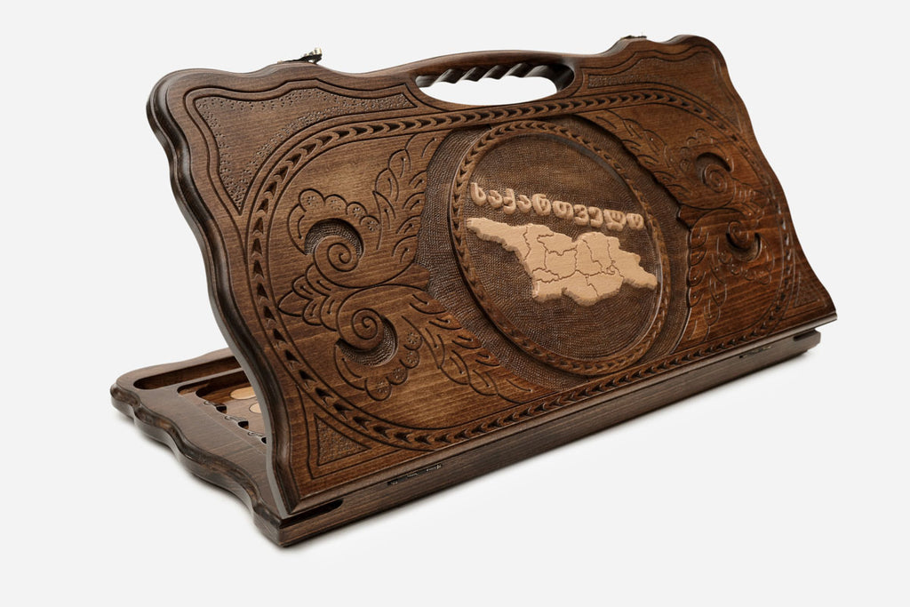 Carved beechwood backgammon board with the map of Georgia and a carry handle, propped open