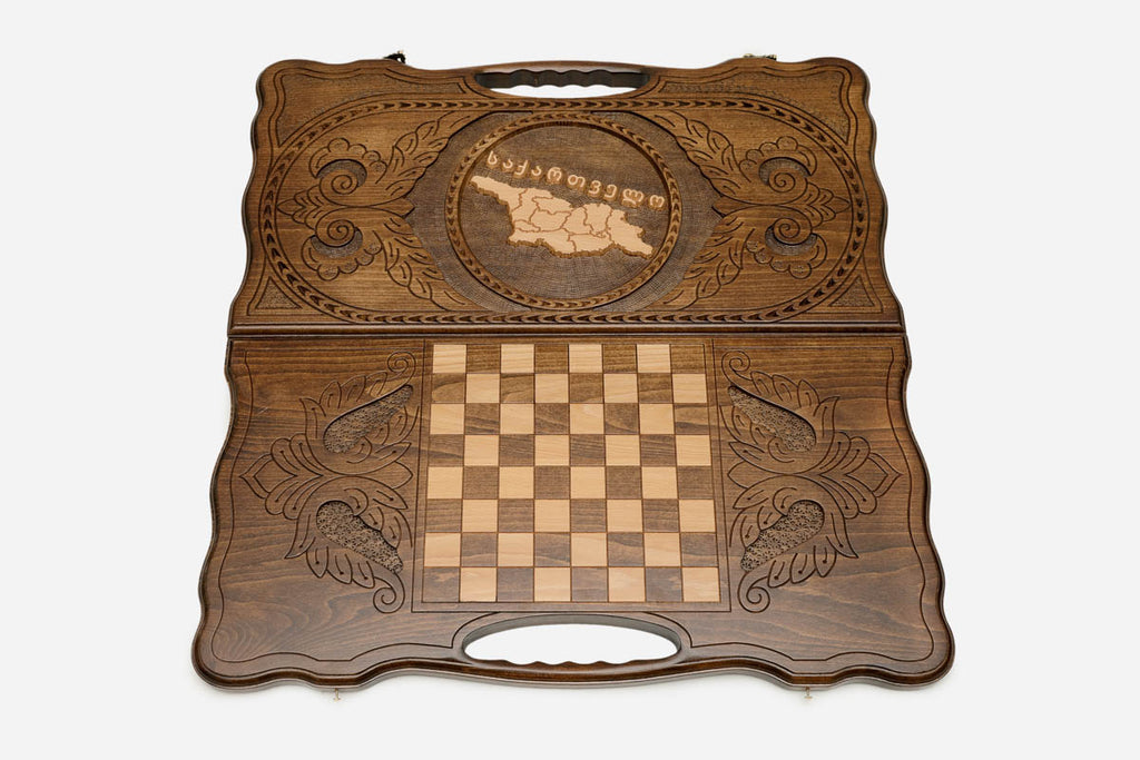 The backgammon board opened to show the wooden playing surface