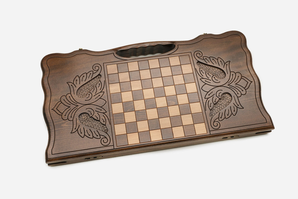 The backgammon board opened to show the wooden playing surface