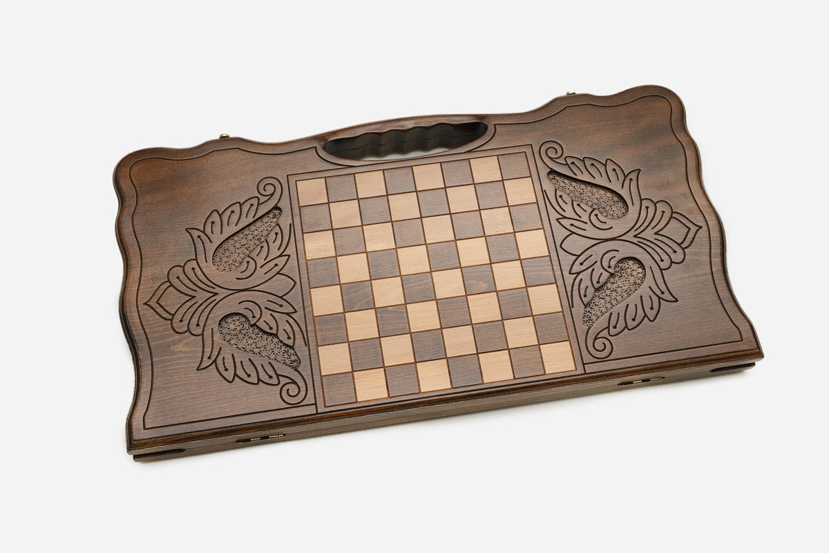 The backgammon board opened to show the wooden playing surface