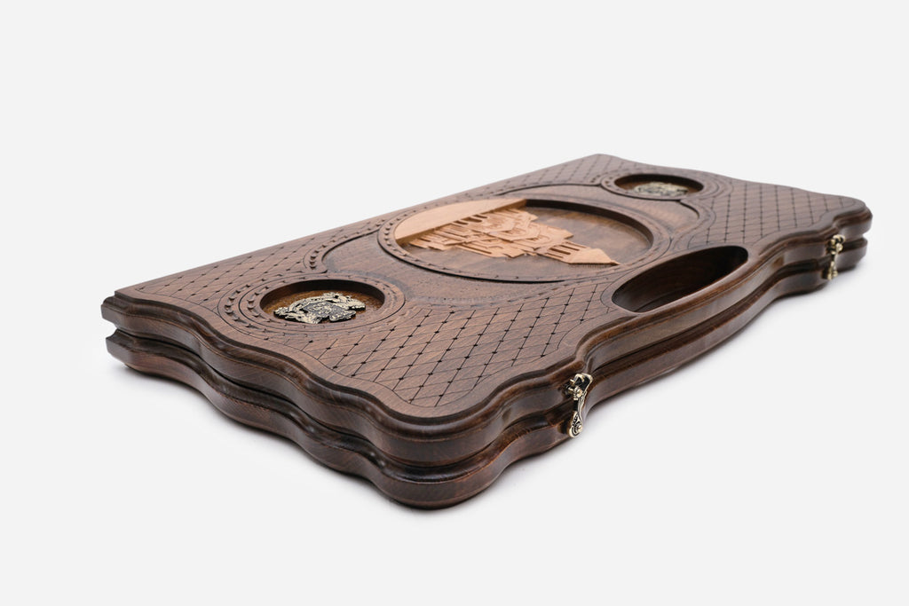 The backgammon board opened to show the wooden playing surface