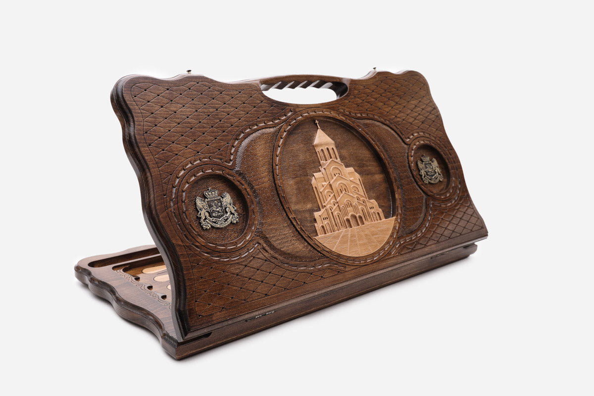 Carved beechwood backgammon board with the Sameba Cathedral of Tbilisi and bronze medallions, with a carry handle, propped open