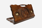 Carved beechwood backgammon board with a wolf medallion and bronze star accents, with a carry handle, propped open