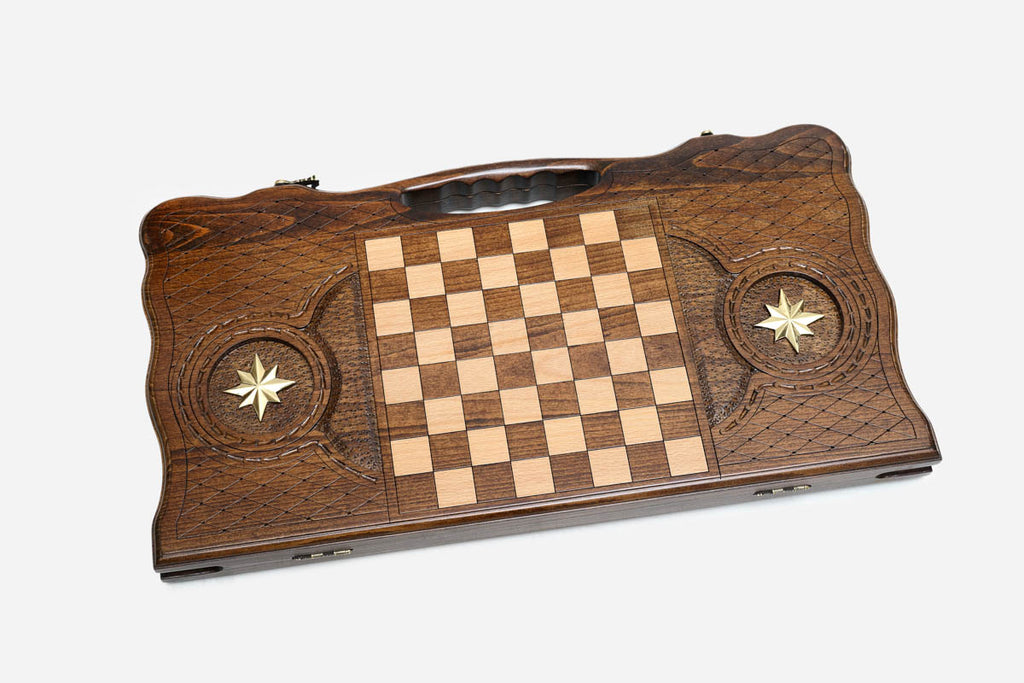 Angled view of the bronze wolf carved backgammon board