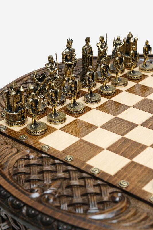 Detail of the carved backgammon-style border and algebraic coordinates around the chess board