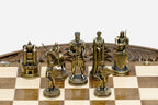 Close-up of the gold-brass Crusader king, queen and mounted knights